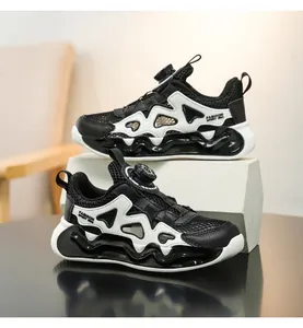 Close-up of children's breathable mesh sneakers with wavy soles and rotary dial lacing system.