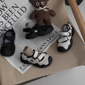 Close-up detail of breathable kids' summer sandals with closed-toe design and soft soles