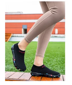 Black breathable water shoes with non-slip sole shown in outdoor setting
