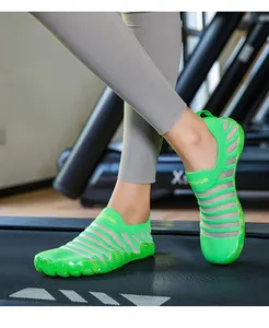 Lightweight breathable lime green striped barefoot training shoes worn on treadmill