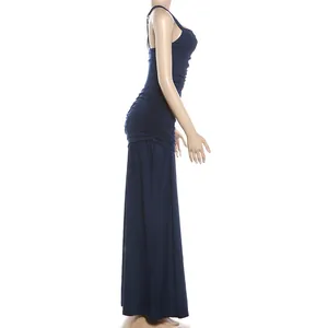 Side profile of a navy blue ruched floor-length dress with square neck on mannequin