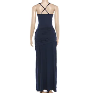 Rear view of navy blue ruched maxi dress with elegant cross back straps and slim fit