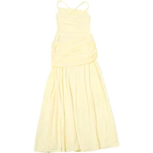 Detailed view of pale yellow ruched maxi dress featuring elegant crossover straps