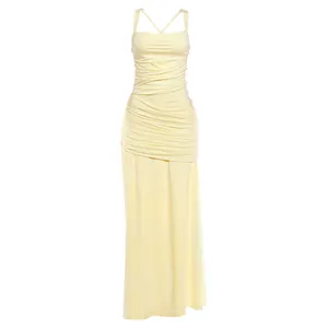 Detailed view of the elegant pale yellow ruched maxi dress with a slim fit design