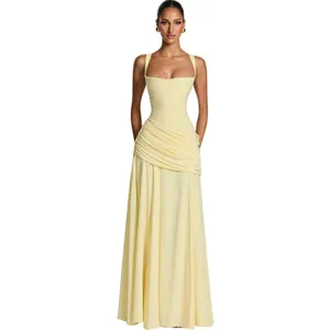 Elegant pale yellow square neck maxi dress featuring intricate pleated waist details