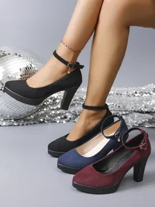 Elegant chunky heel suede pumps with ankle strap shown in black, navy, and burgundy.