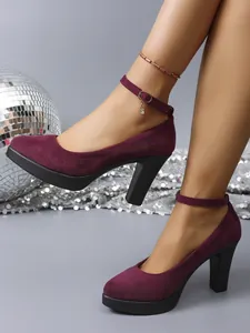 Detail view of purple suede round toe high heels with adjustable ankle buckle strap