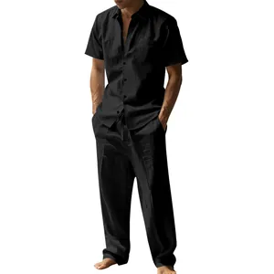 A detailed view of a black linen short sleeve shirt and matching long pants set for men