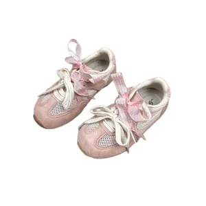 Pink girls mesh sports shoes with ribbon bows and breathable mesh panels