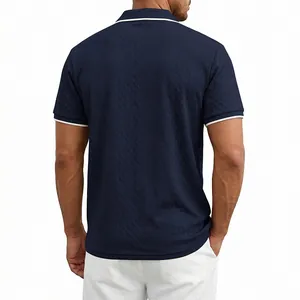 Rear view of men's navy blue heavy jacquard knit polo shirt with white contrast cuffs.