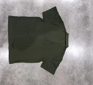 Macro view of dark green men's Polo shirt with vertical cable-knit texture.