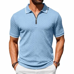 Close-up of men's blue vintage jacquard polo shirt with zipper and textured fabric detail.