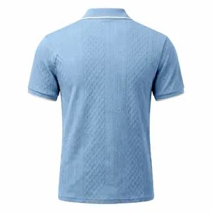 Back view of a vintage light blue jacquard polo shirt with textured pattern detail