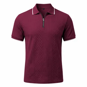 Detailed view of men's burgundy polo shirt with zipper and chevron jacquard texture