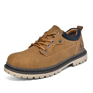Detailed side view of stylish brown men's work boots with durable rubber lug soles