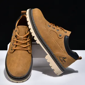 Macro view of tan men's work boots showing high-quality suede texture and Salkin logo