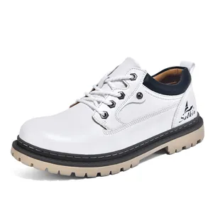 Detailed side view of men's white leather mid-top work boots featuring a rugged lug sole