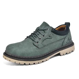 Detail view of stylish men's teal nubuck work boots featuring a durable lug sole