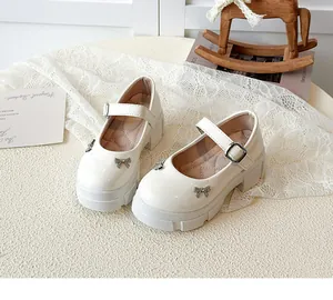 Off-white vintage platform Mary Jane shoes with sparkling rhinestone bow detail