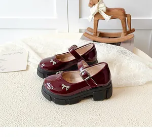 Classic burgundy platform Mary Jane shoes with silver bow detail in French style