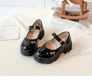 Retro black patent leather Mary Jane shoes with platform soles and rhinestone bows