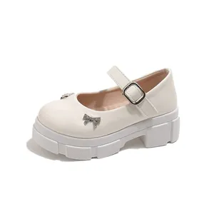 Elegant white platform Mary Jane shoes with sparkling bow details and retro French style.