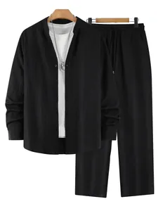 Detailed macro view of men's black vertical striped Henley shirt and matching trousers set