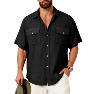 Detail view of men's black linen-like short sleeve shirt with functional chest pockets.