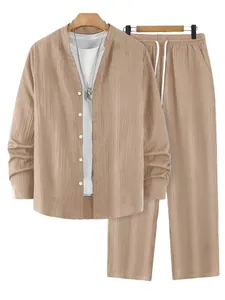 Close-up detail of men's autumn khaki striped henley shirt and matching trousers set