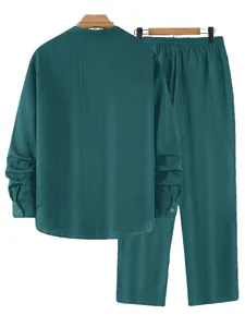 Back view of men's teal green striped long-sleeve henley shirt and trouser set