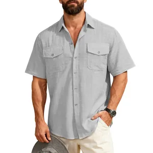 Close-up detail of grey linen-like short-sleeved work shirt with double chest pockets