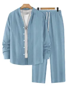 Detail view of men's blue striped long-sleeve henley shirt and matching pants set