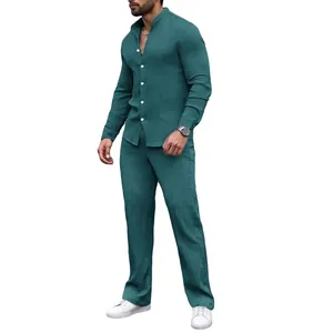 Men's teal pleated two-piece set featuring a stand collar shirt and matching trousers