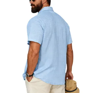 Back view of a casual light blue linen-textured short sleeve shirt on a male model