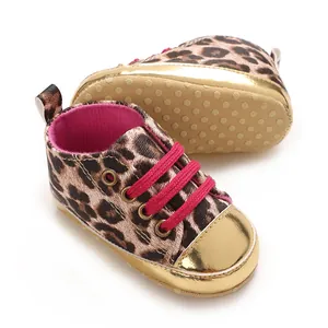 Detail shot of leopard print baby shoes with metallic gold toe and anti-slip sole