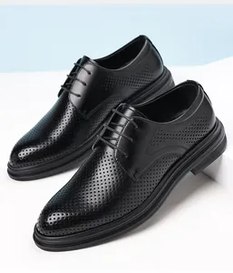 Detail of breathable black perforated men's formal dress shoes for weddings