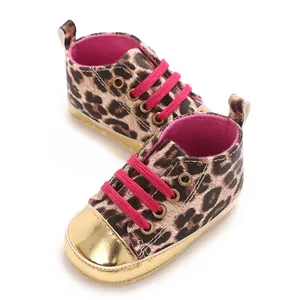 Detailed view of leopard print baby walking shoes with pink laces and gold toes