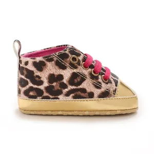 Detailed side view of leopard print baby shoe with vibrant pink laces and gold metallic trim