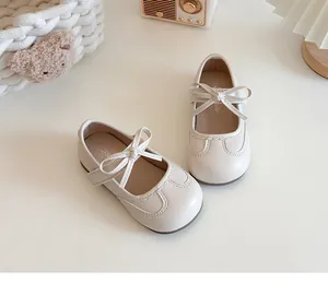 Elegant creamy white girls' Mary Jane shoes with delicate bow knot and scalloped edges