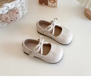 Top view of cream girls' Mary Jane shoes with delicate bow and stitched detailing