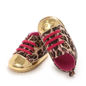 Leopard print baby walking shoes with gold metallic toe caps and bright pink laces