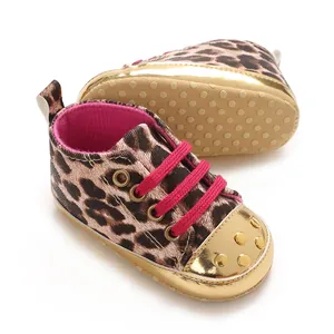 Detailed view of leopard print baby pre-walker shoes with gold toe cap and pink laces