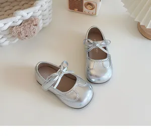 Top view detail of silver toddler girl Mary Jane shoes with a cute delicate bow knot