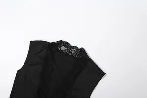 Detail of French style V-neck with intricate black lace trim on sleeveless tank top