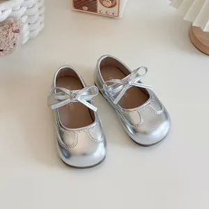 Elegant silver princess style girl's Mary Jane shoes with decorative bow and soft sole.