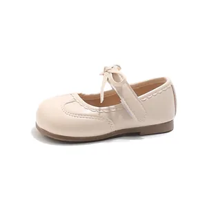 Elegant girls beige princess Mary Jane shoes with bow and cute scalloped trim details