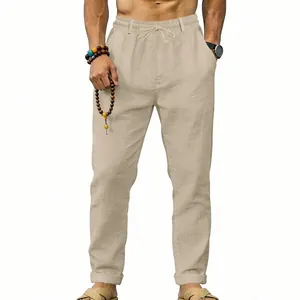 Close-up of men's loose-fit linen trousers in beige perfect for casual resort and vacation wear