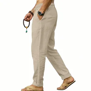Side view of men's beige linen pants showing breathable fabric texture and loose fit