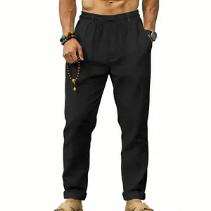 Detailed front view of men's loose black linen pants featuring a comfortable drawstring waist