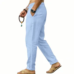 Side view of light blue men's linen straight-leg trousers with drawstring waist.